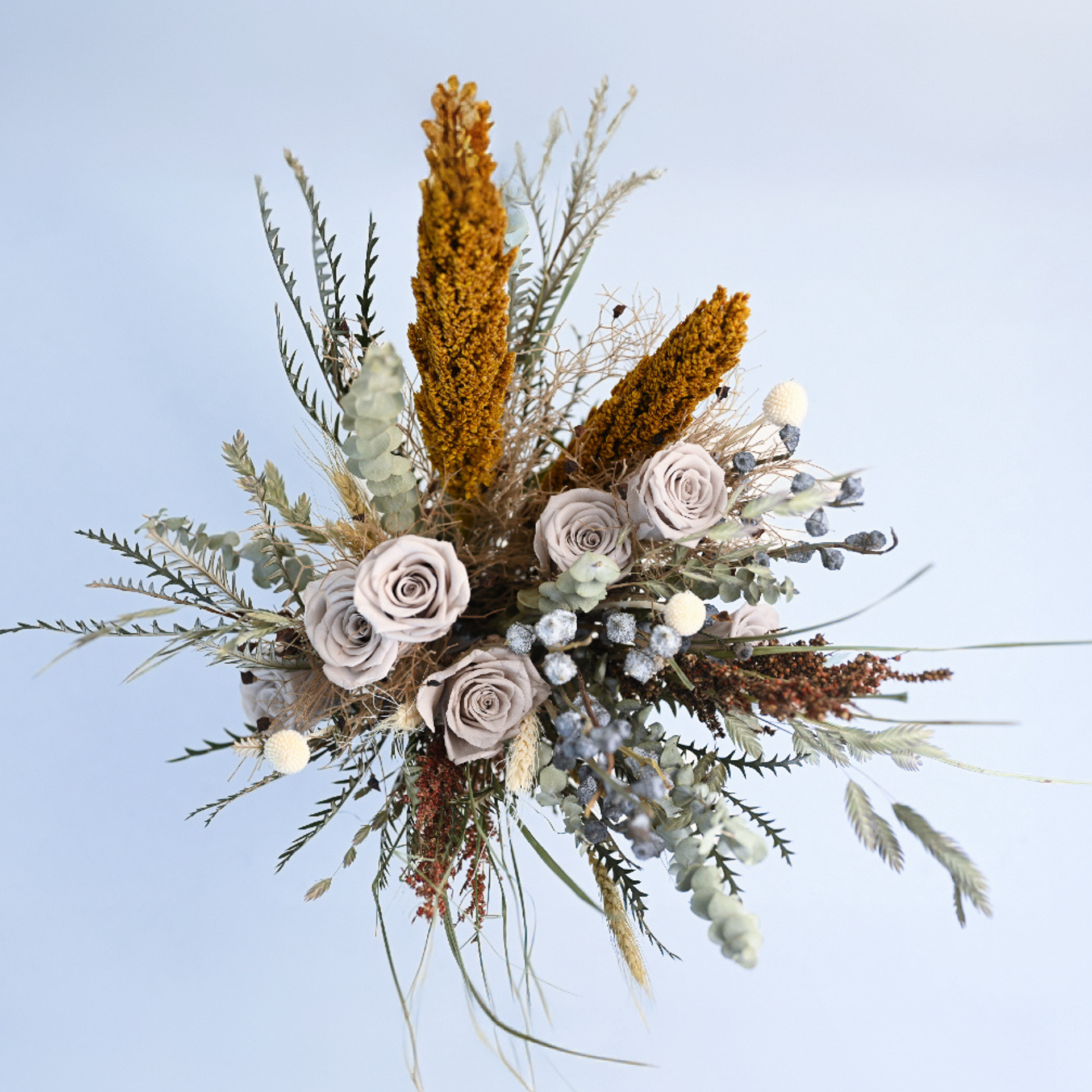 Aerial view of Canyon Muse Preserved Flower Bouquet showing grey roses, craspedia, wheat, oat grass and silver berry