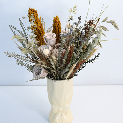 Canyon Muse Preserved Flower Bouquet displayed in a ceramic bow vase, front view