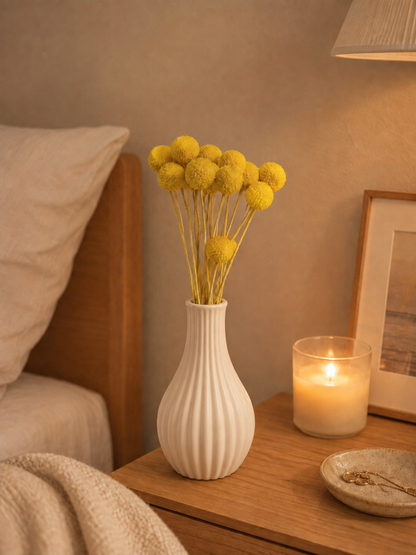 Golden yellow dried craspedia billy buttons styled in a vase for home decor