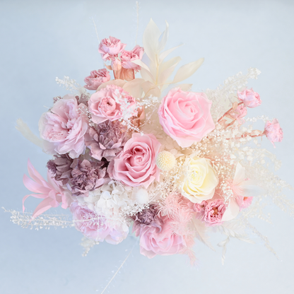 Aerial view of Blush Muse Preserved Flower Bouquet showing pink roses, spray roses, hydrangea, celosia and gossamer grass in blush and cream tones