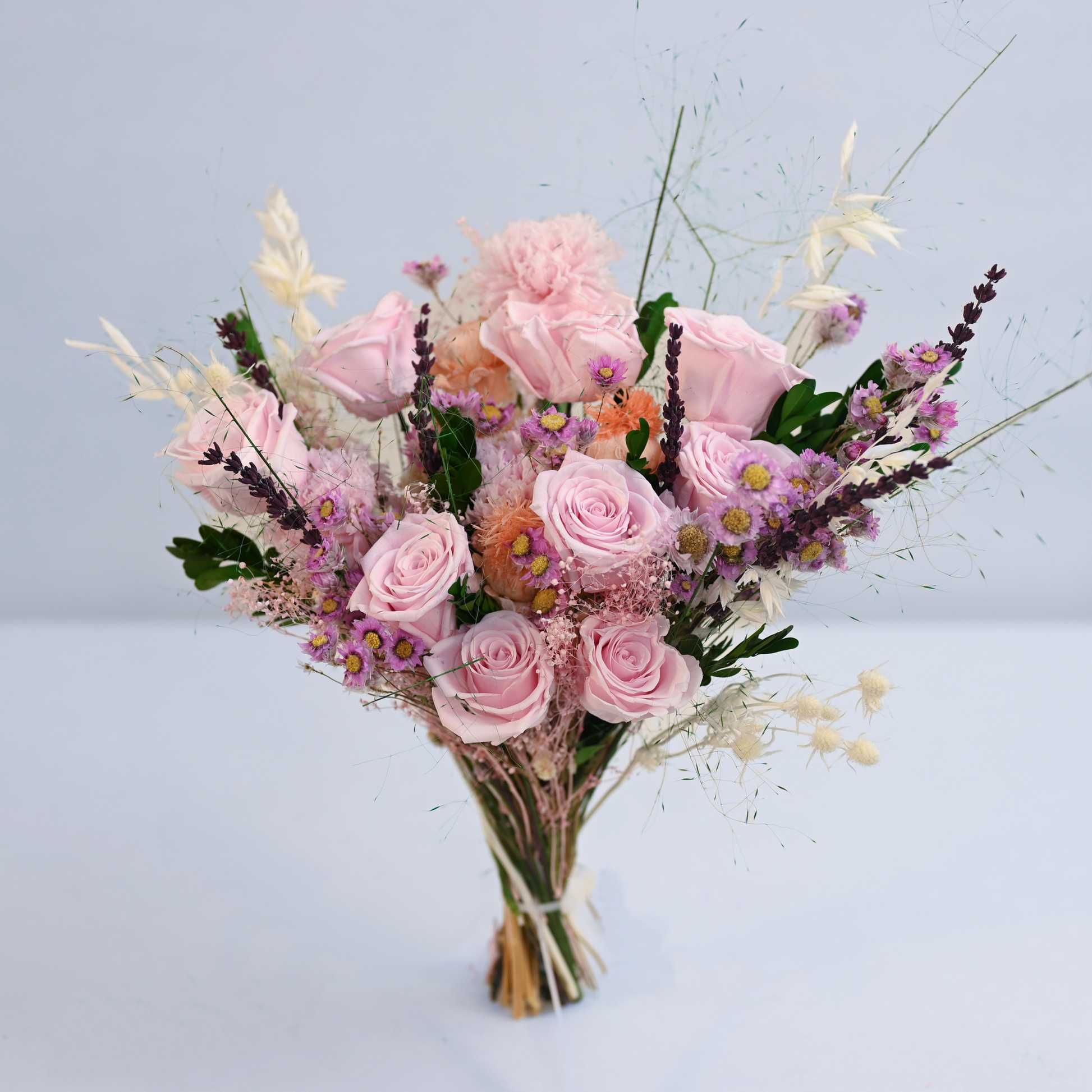 Wild Rose Preserved Flower Bouquet hand-tied bouquet of pink roses, carnation, lavender, and oat grass without vase