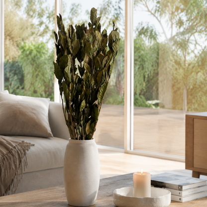 Natural green preserved oak leaves stem styled in a vase