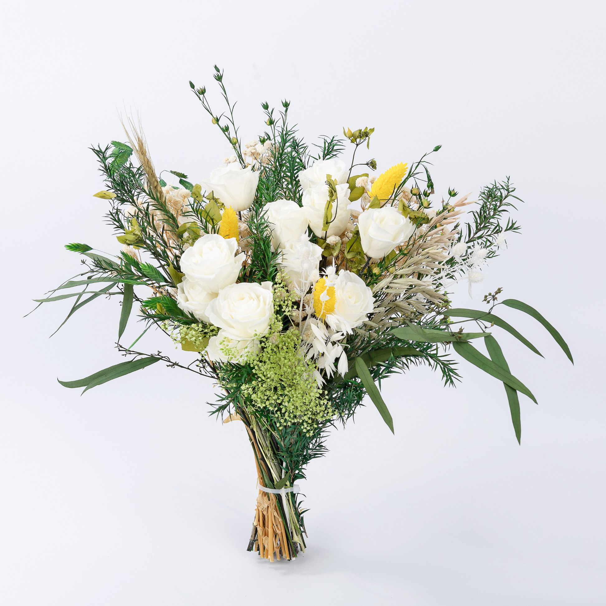 Overhead flat lay of Opal Meadow Preserved Flower Bouquet featuring white roses, oat grass, asparagus fern and eucalyptus