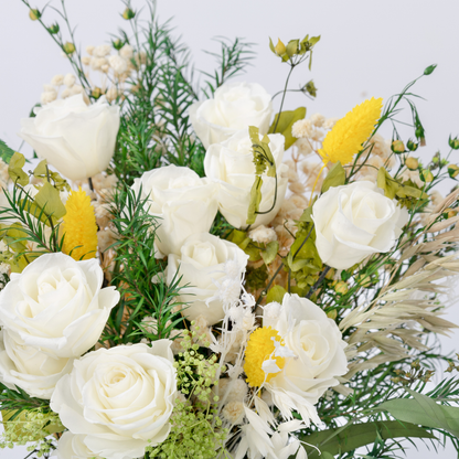 Opal Meadow Preserved Flower Bouquet standing upright showing full height with white roses and trailing green foliage, front view