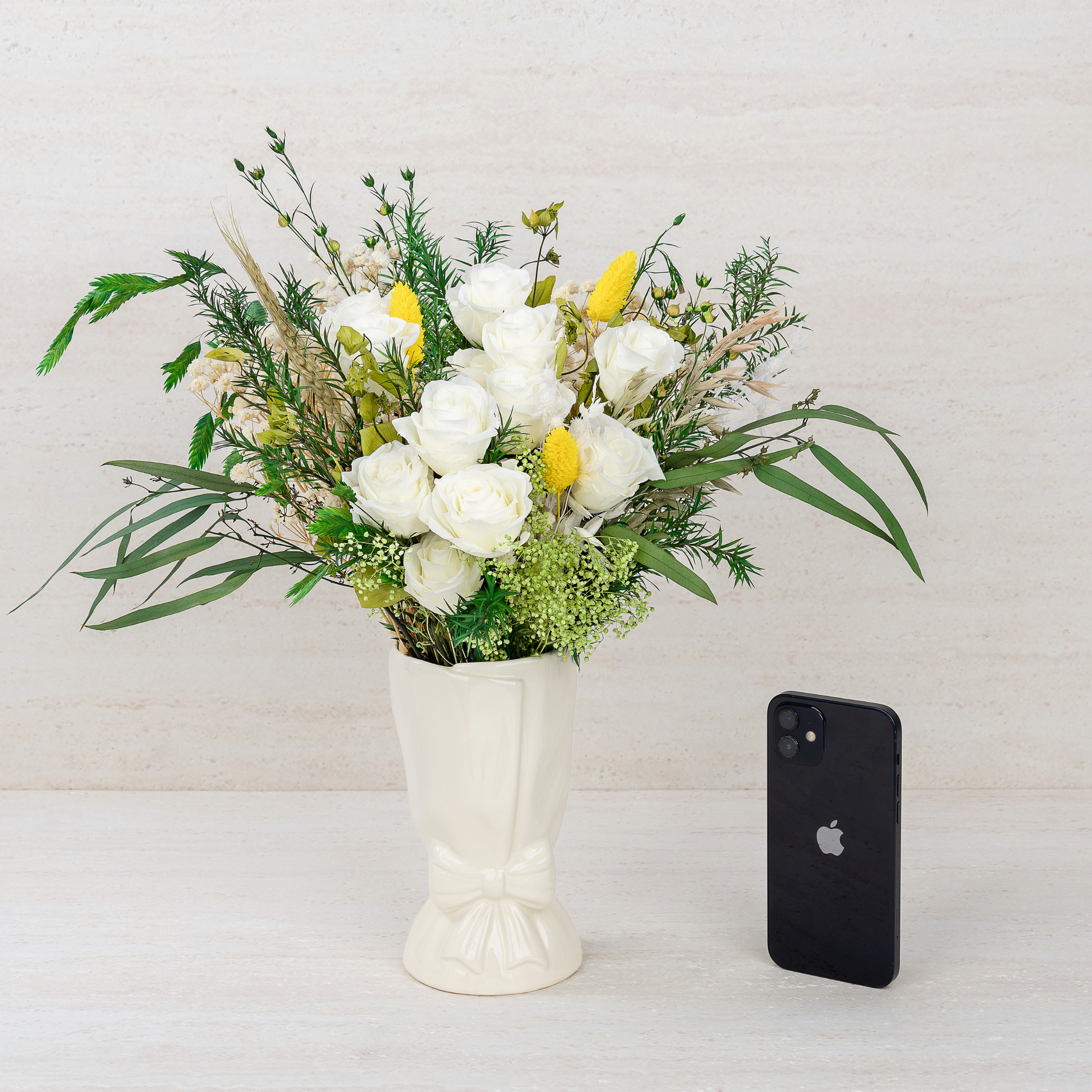 Close-up detail of Opal Meadow Preserved Flower Bouquet showing white roses, yellow craspedia, baby's breath and green botanicals